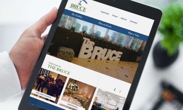 'The Bruce' convention center website on a tablet